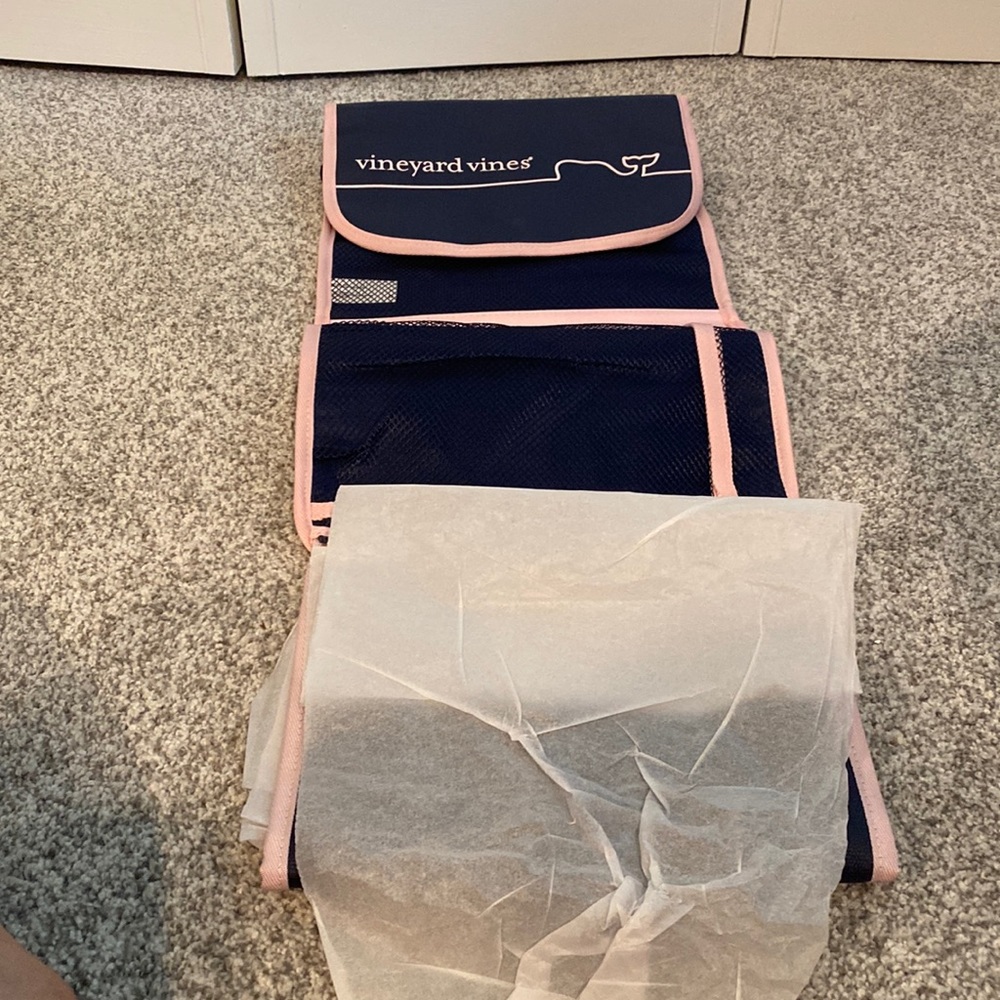 Brand new with tags. Diaper clutch and changing pad.